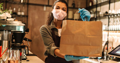 Woman Carrying A Paper Bag